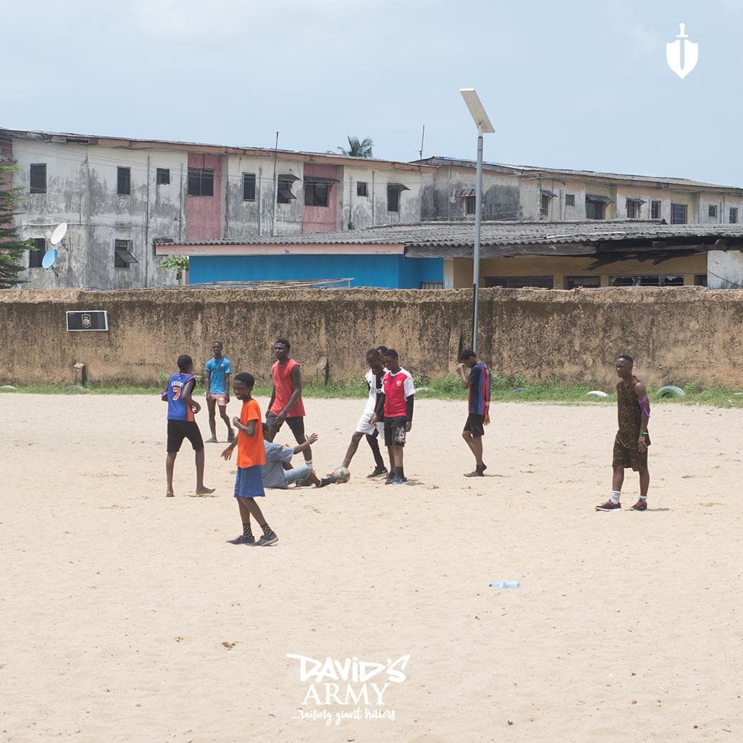 Boys from David's Army playing football on an outdoor pitch